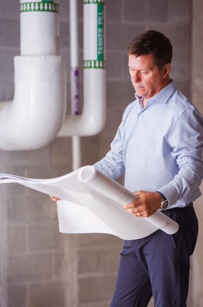 TomStenzel.LookingAtPlans1 1-min